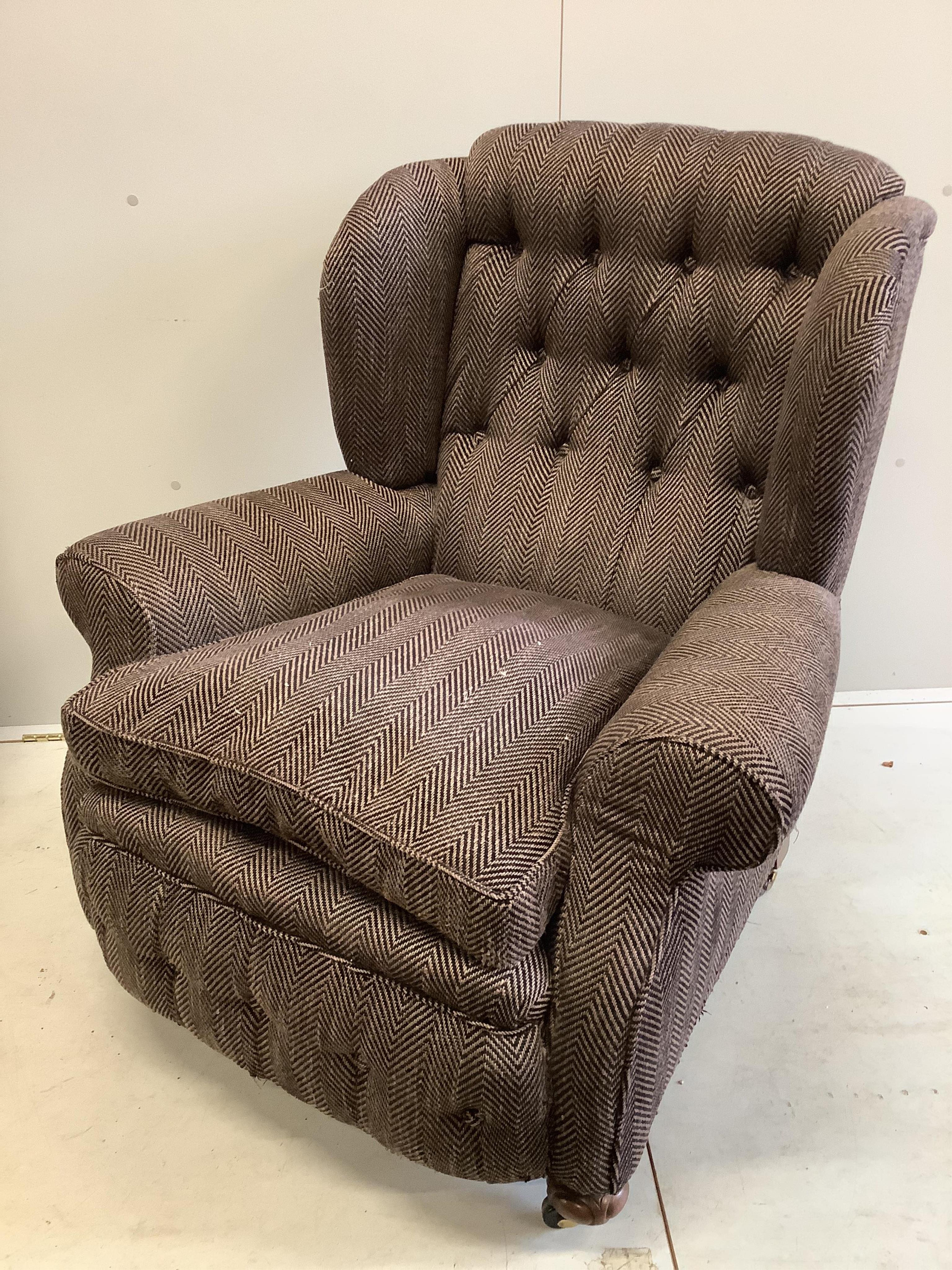 A near pair of early 20th century upholstered armchairs, recently upholstered, larger width 92cm, depth 90cm, height 98cm, together with a spare roll of upholstery fabric. Condition - good